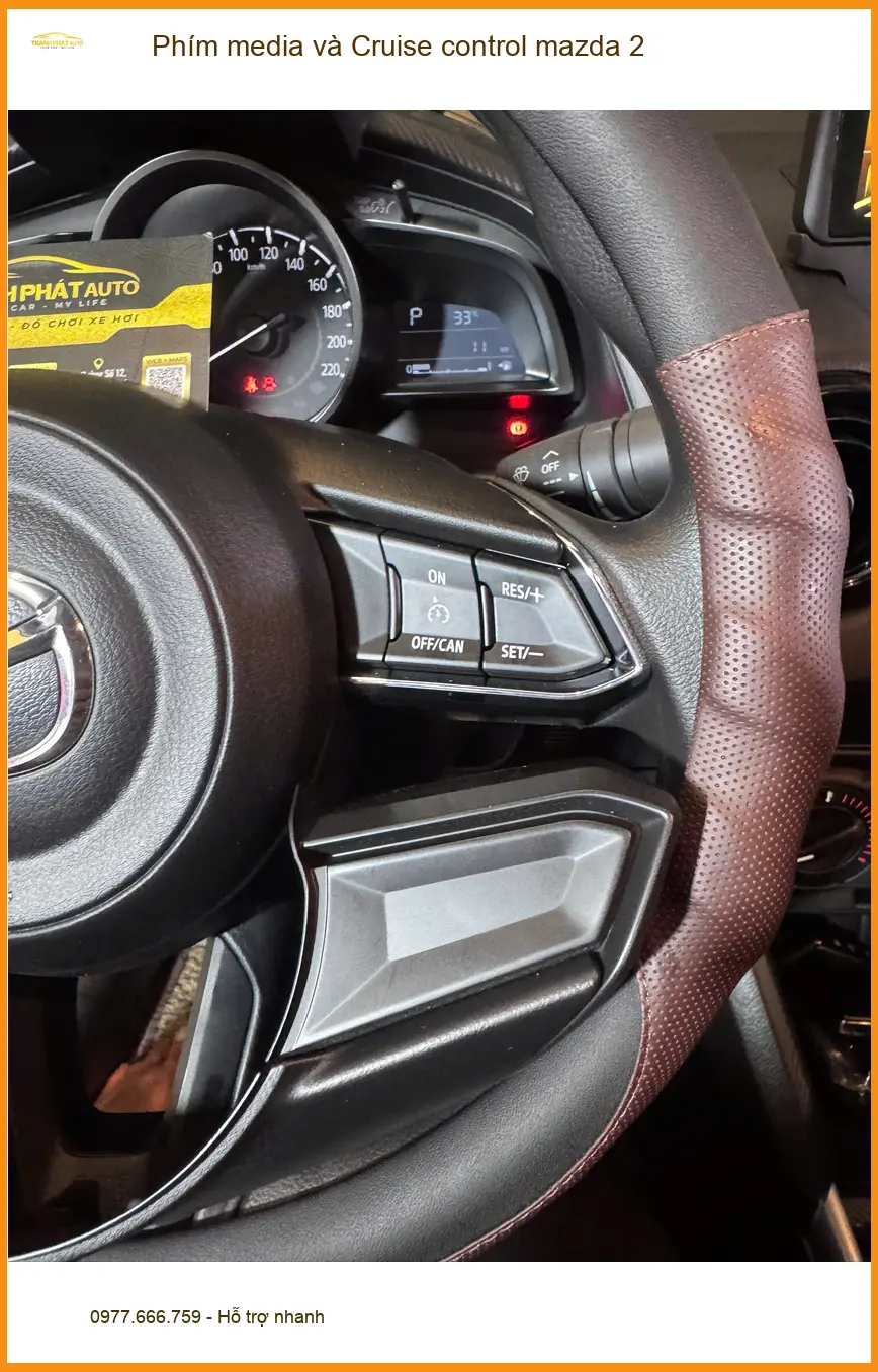 Chị Thảo lắp Phím media và Cruise control cho Mazda 2 tại Quận 3 để lái xe tiện lợi hơn ảnh thực tế 2