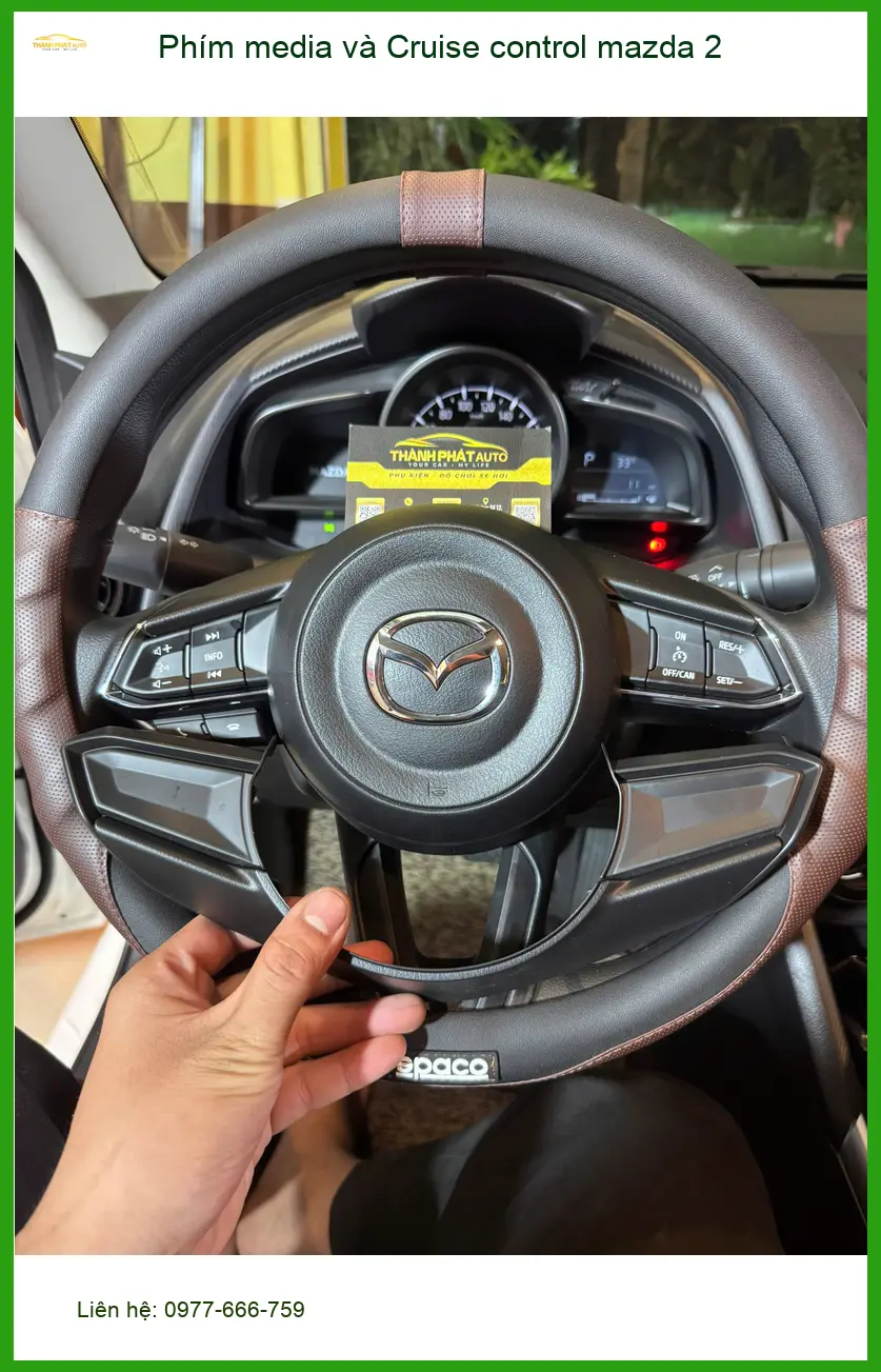 Chị Thảo lắp Phím media và Cruise control cho Mazda 2 tại Quận 3 để lái xe tiện lợi hơn ảnh thực tế 3